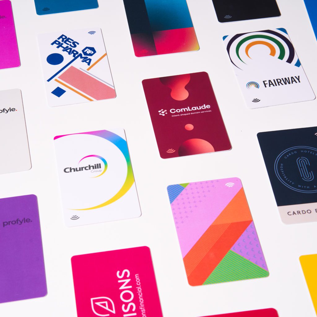 Multiple contactless business cards from various brands like Profyle, ComLaude, Churchill Group, and Fairway.