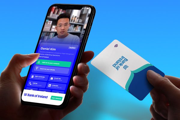 Hands holding a smartphone displaying a video call with Daniel Kim and a card with Bank of Ireland logo.