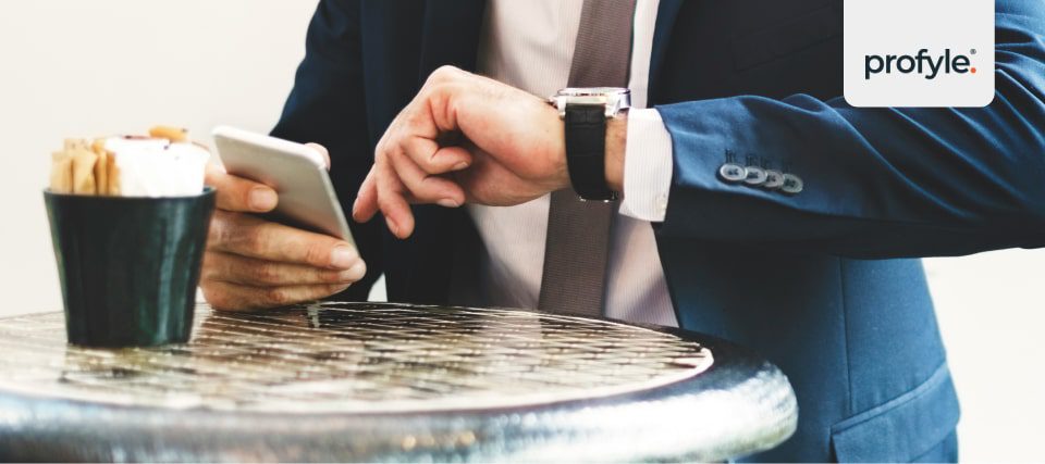 A businessman looking at a smart watch