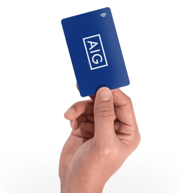 Hand holding a blue card with AIG logo and wireless symbol