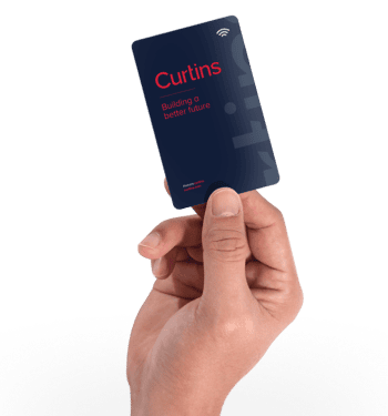 Hand holding a dark blue card with 'Curtins' in red text, 'Building a better future' in white, and a Wi-Fi symbol.